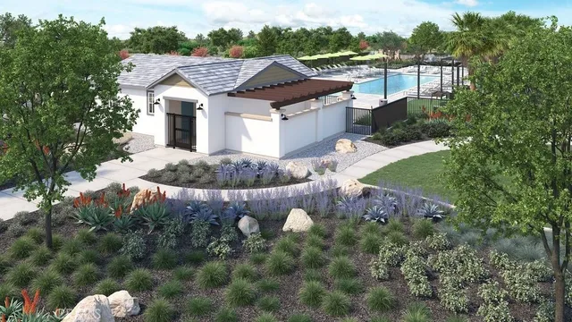 a aerial view of a house with a yard and covered with green space