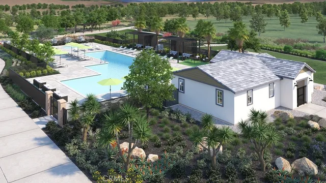 an aerial view of a house with a yard and lake view