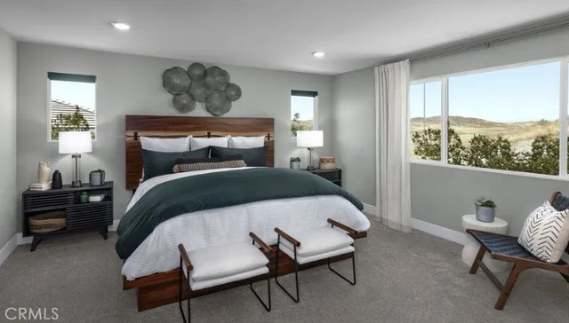 a bedroom with a bed and window