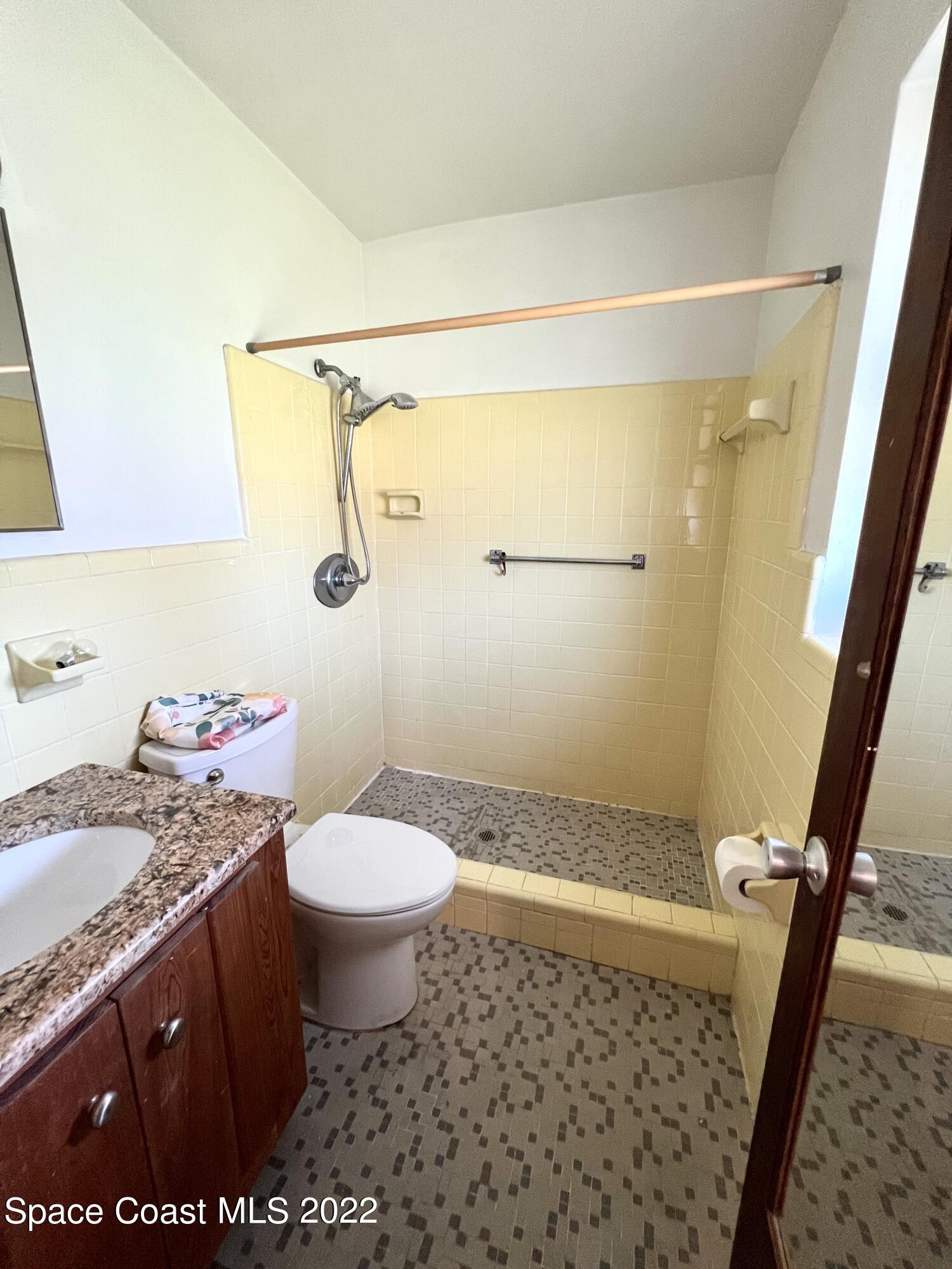 282 Fay Drive Indialantic, FL 32903 - Photo 19 of 27 a bathroom with a sink a toilet and shower