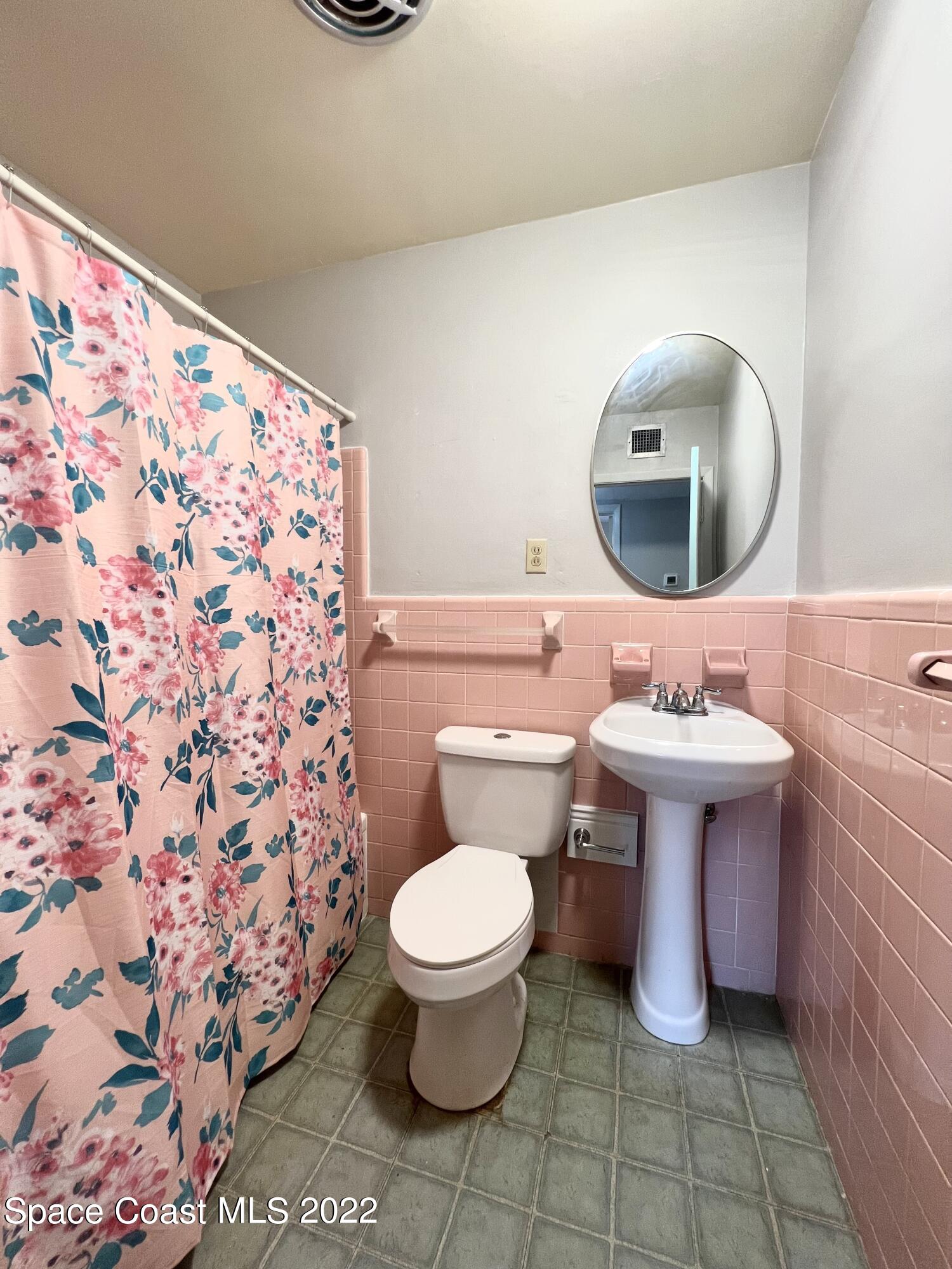 282 Fay Drive Indialantic, FL 32903 - Photo 22 of 27 a bathroom with a sink toilet and mirror