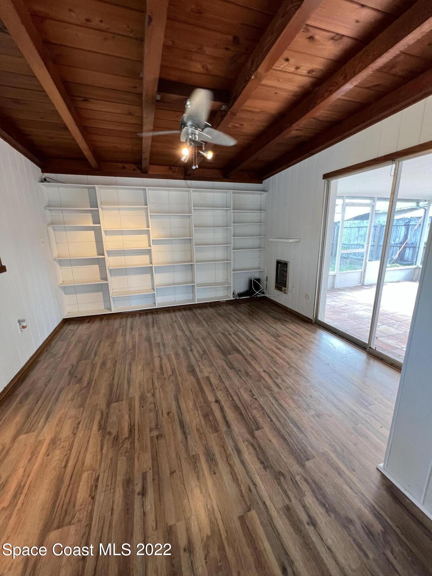 282 Fay Drive Indialantic, FL 32903 - Photo 23 of 27 a view of an empty room with wooden floor