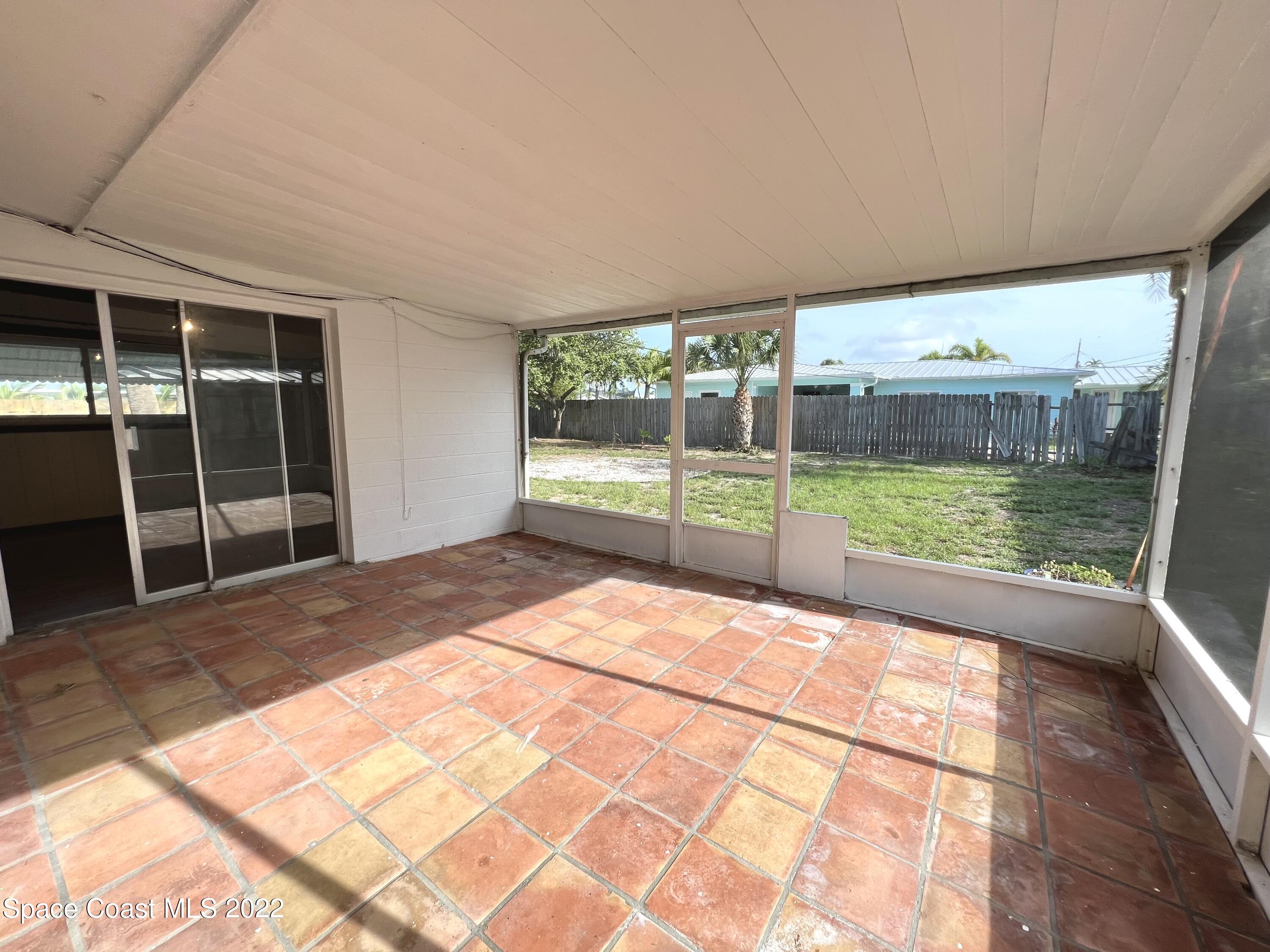 282 Fay Drive Indialantic, FL 32903 - Photo 24 of 27 a view of an empty room with a balcony