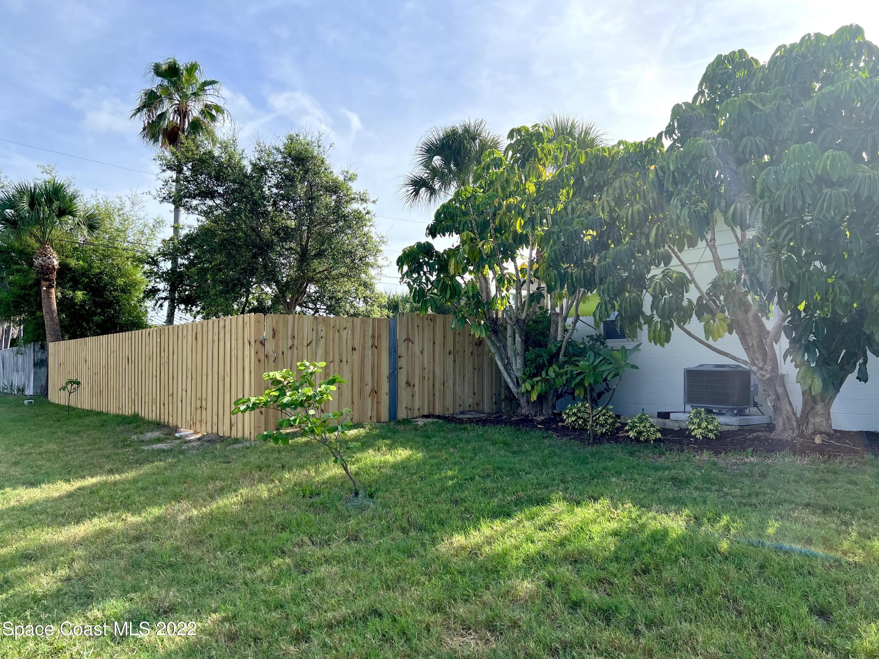 282 Fay Drive Indialantic, FL 32903 - Photo 27 of 27 a view of a backyard with a garden