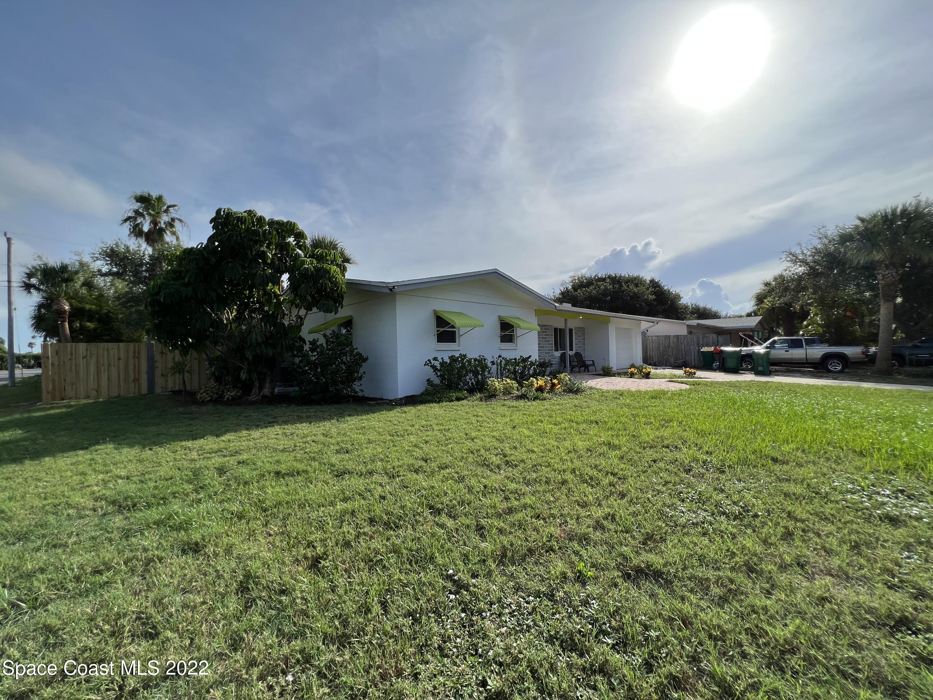 282 Fay Drive Indialantic, FL 32903 - Photo 4 of 27 a house view with a garden space