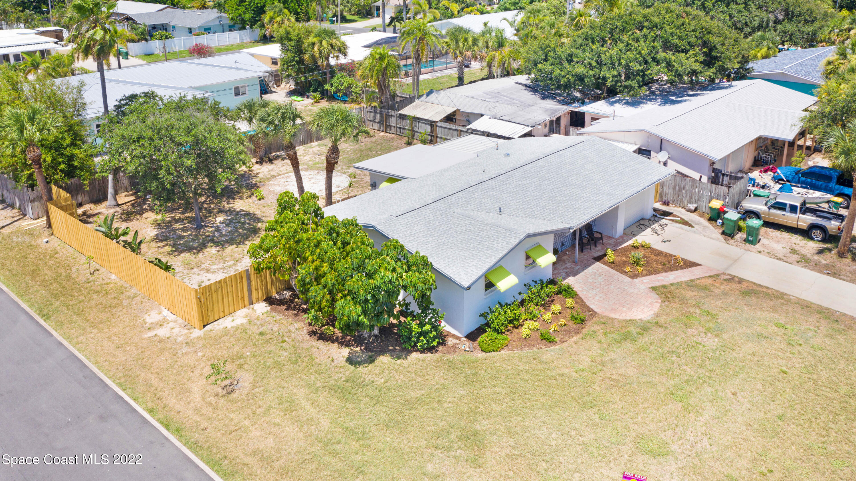 282 Fay Drive Indialantic, FL 32903 - Photo 6 of 27 an aerial view of a house with swimming pool and outdoor seating