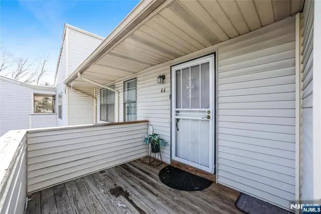 a view of a balcony with wooden floor