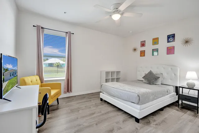 a bedroom with a bed and a table