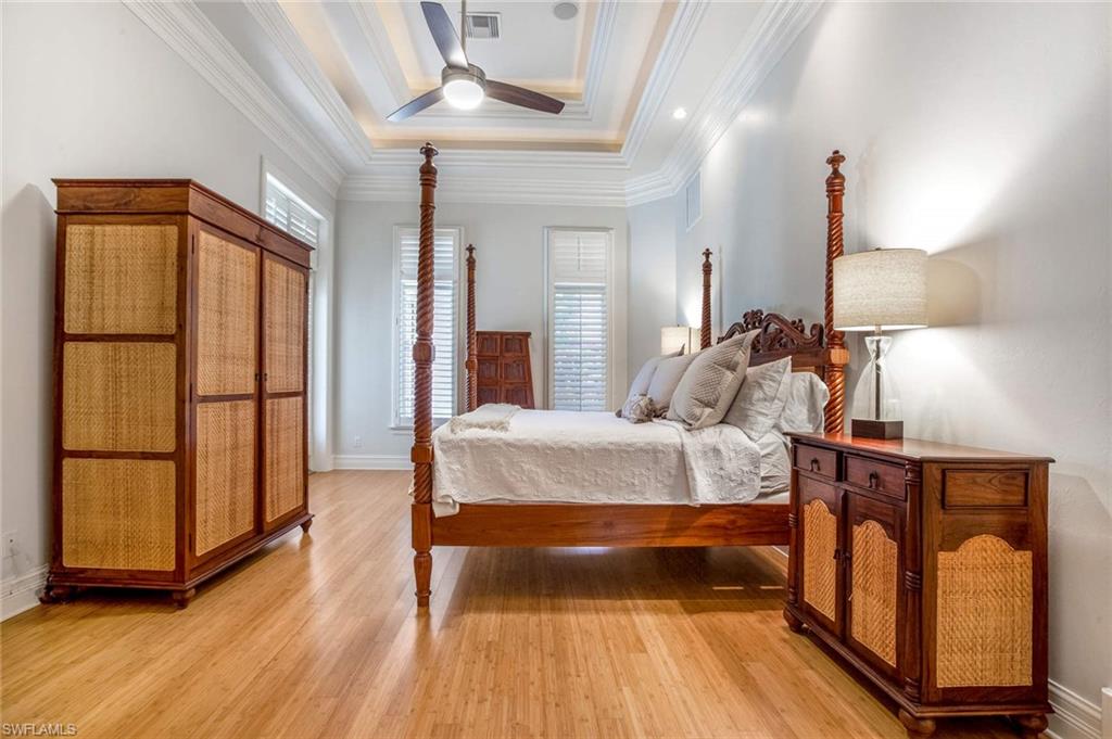 516 Portside Drive Naples, FL 34103 - Photo 16 of 33 a bed room with a bed and a window