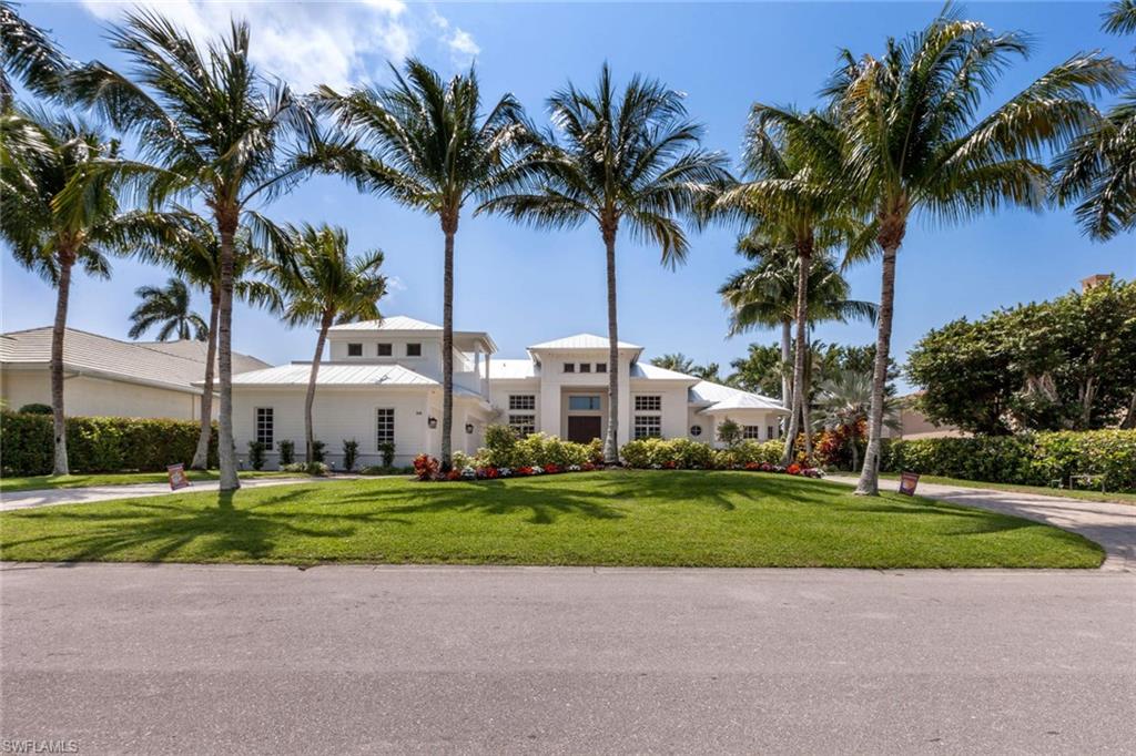 516 Portside Drive Naples, FL 34103 - Photo 2 of 33 a view of a park with palm trees