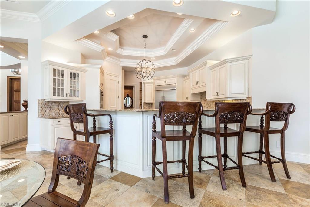 516 Portside Drive Naples, FL 34103 - Photo 22 of 33 a view of a dining room with furniture