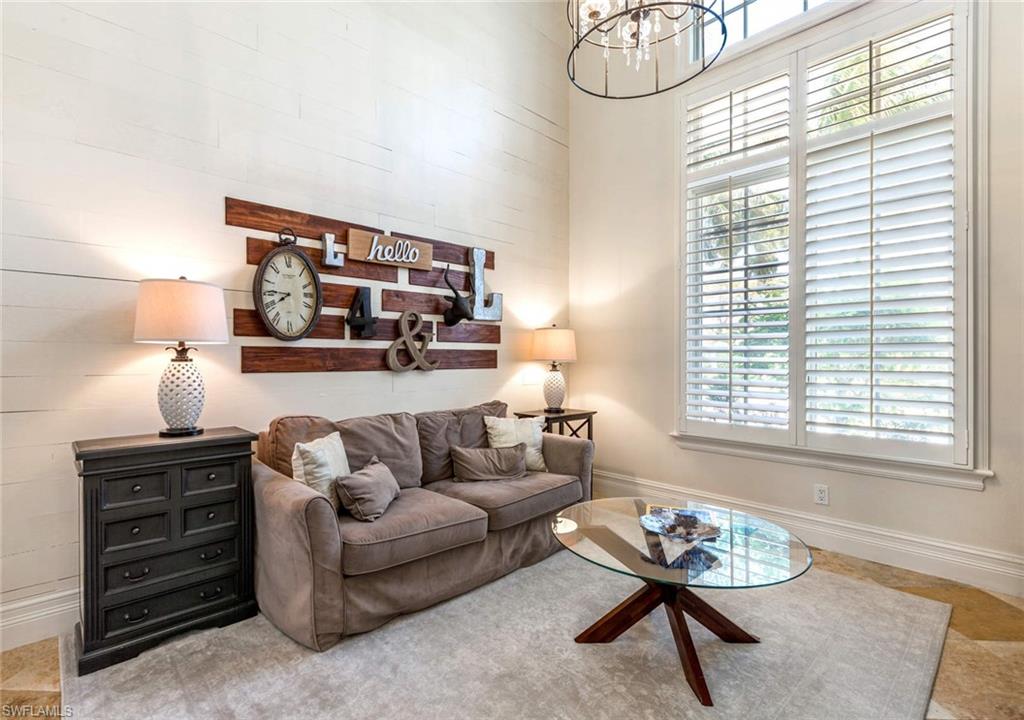 516 Portside Drive Naples, FL 34103 - Photo 7 of 33 a living room with furniture and a window