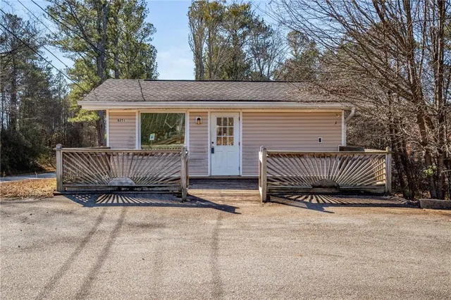 a view of a house with a bed and a roof deck