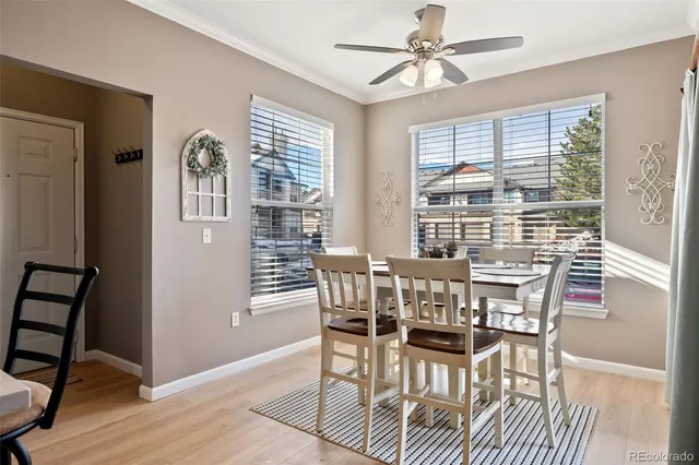 a view of a dining room with furniture window and wooden floor