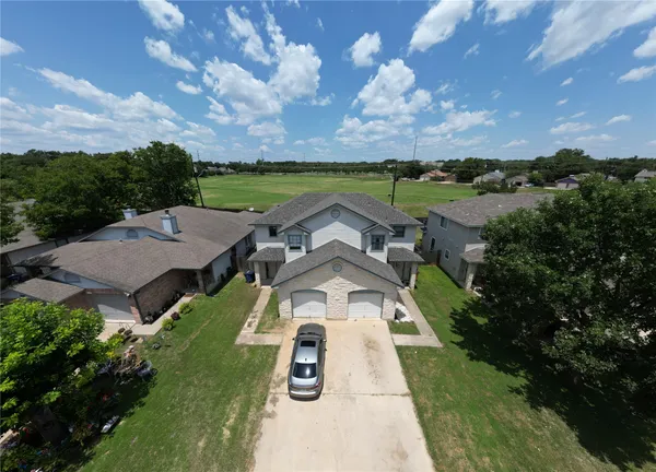 an aerial view of a house with a garden