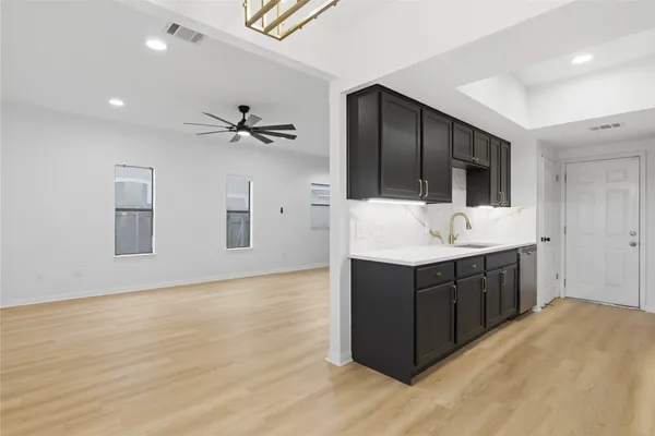 a kitchen with a cabinet and a sink