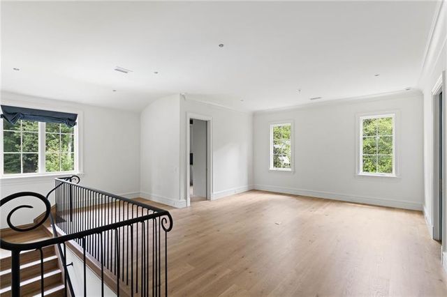 a view of outdoor space with green field and trees