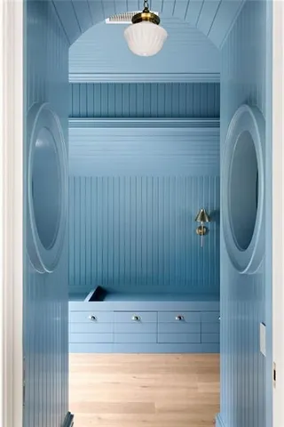 an aerial view of a house with a yard and trees