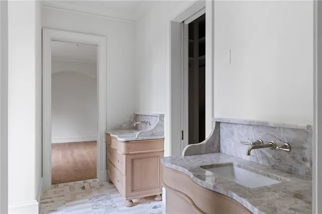 a front view of a building with a garden