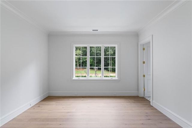 a view of a brick house with a yard