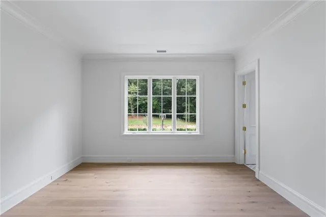 a view of a brick house with a yard