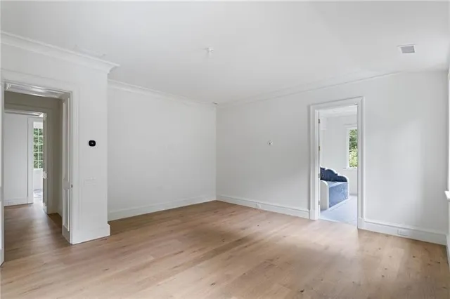 a front view of a house with a garden and yard