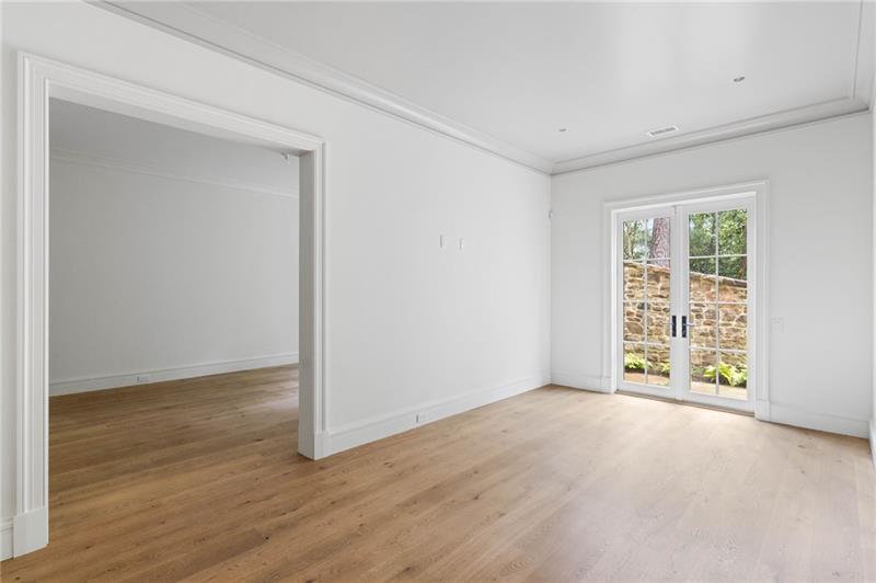41 Blackland Road Northwest Atlanta, GA 30342 - Photo 78 of 106 an empty room with wooden floor and windows