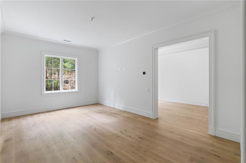 41 Blackland Road Northwest Atlanta, GA 30342 - Photo 79 of 106 an empty room with wooden floor and windows