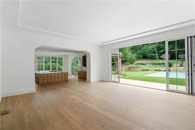 an aerial view of a house with a yard and potted plants