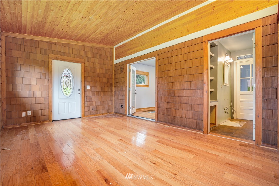 17510 Southeast 121st Place Renton, WA 98059 - Photo 12 of 40 a view of empty room with wooden floor and entryway