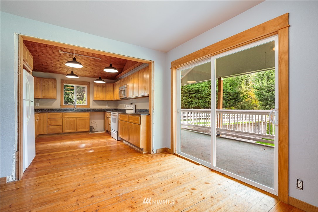 17510 Southeast 121st Place Renton, WA 98059 - Photo 16 of 40 a view of a kitchen with wooden floor and a kitchen