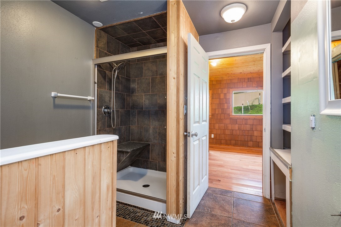 17510 Southeast 121st Place Renton, WA 98059 - Photo 18 of 40 a bathroom with a glass shower door