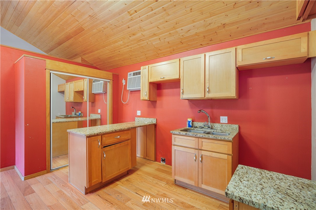 17510 Southeast 121st Place Renton, WA 98059 - Photo 29 of 40 a kitchen with a sink stove and cabinets