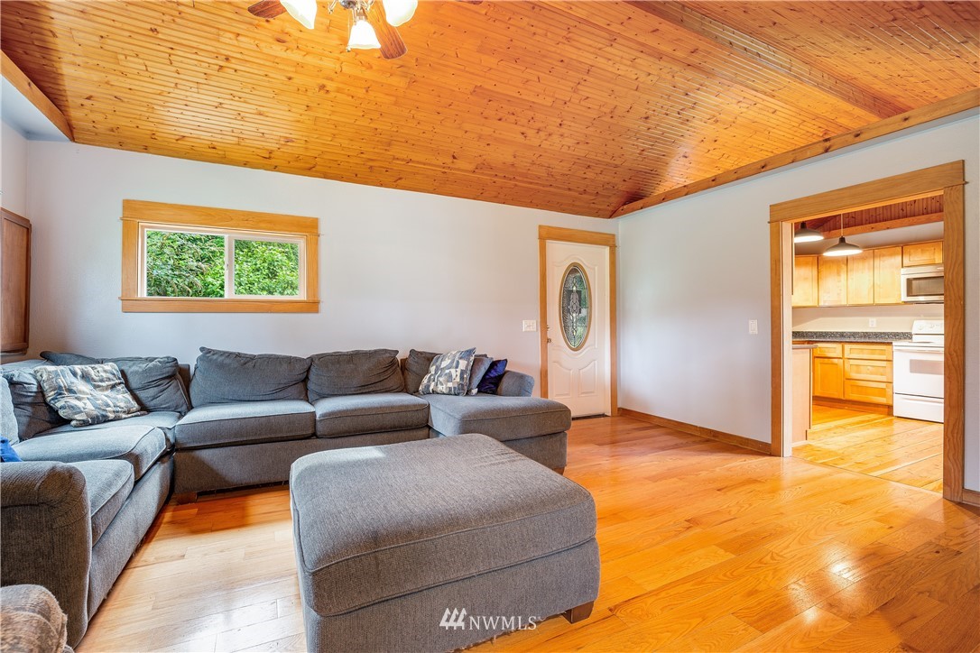 17510 Southeast 121st Place Renton, WA 98059 - Photo 7 of 40 a living room with furniture and a window
