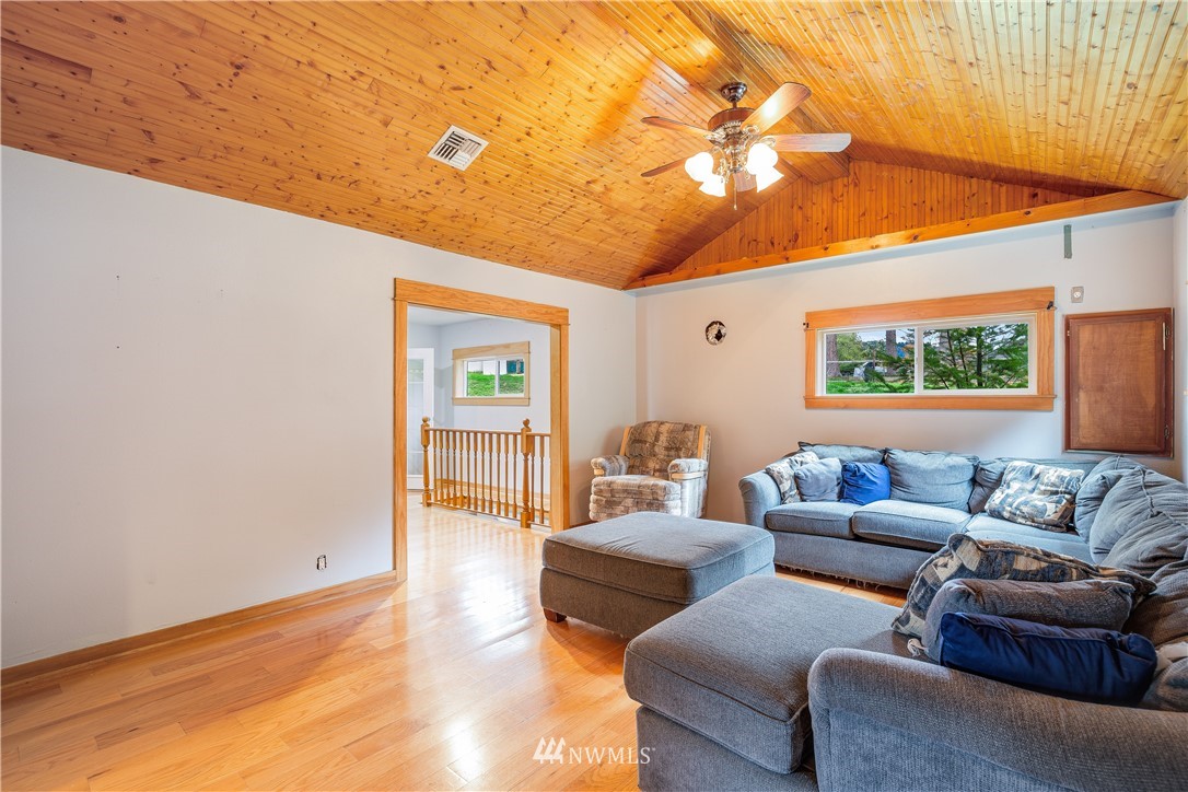 17510 Southeast 121st Place Renton, WA 98059 - Photo 9 of 40 a living room with furniture and a large window