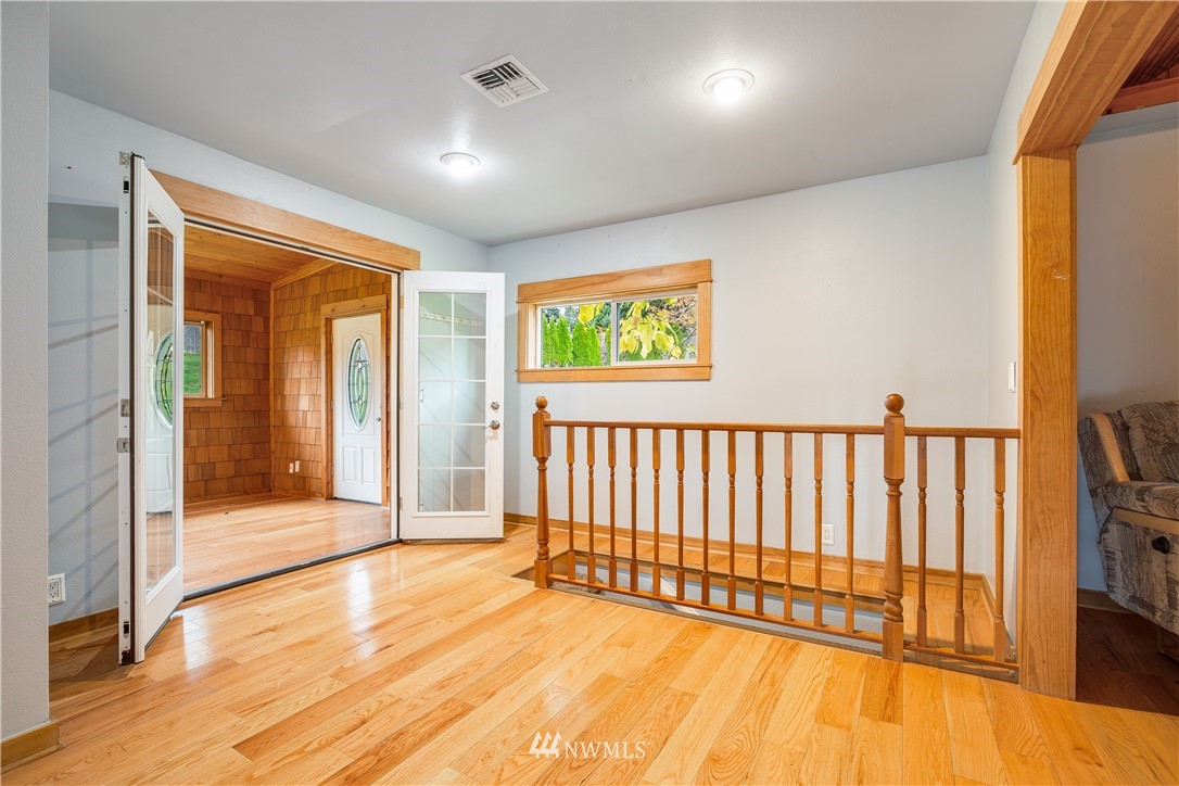 17510 Southeast 121st Place Renton, WA 98059 - Photo 10 of 40 a view of a room with wooden floor