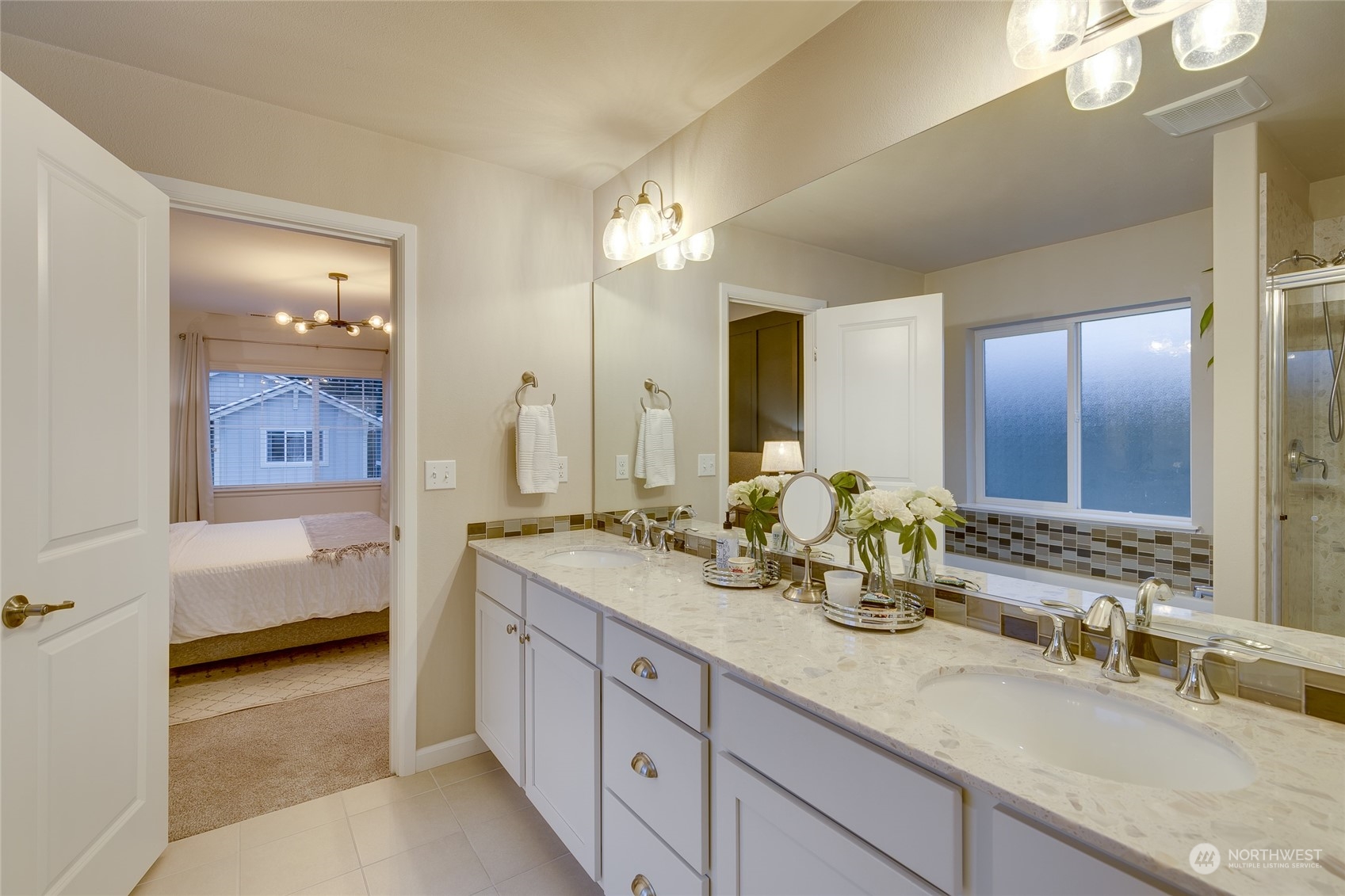 15932 Meridian Avenue South Bothell, WA 98012 - Photo 23 of 33 a spacious bathroom with double vanity a mirror a vanity and a bathtub