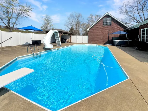 a view of a backyard with a patio