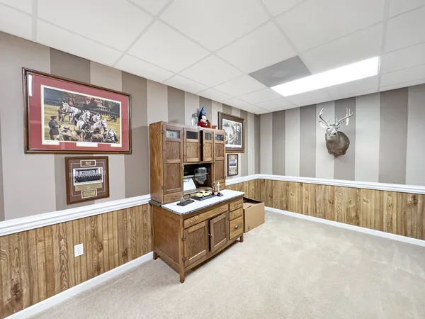 a bedroom with a bed and a fireplace