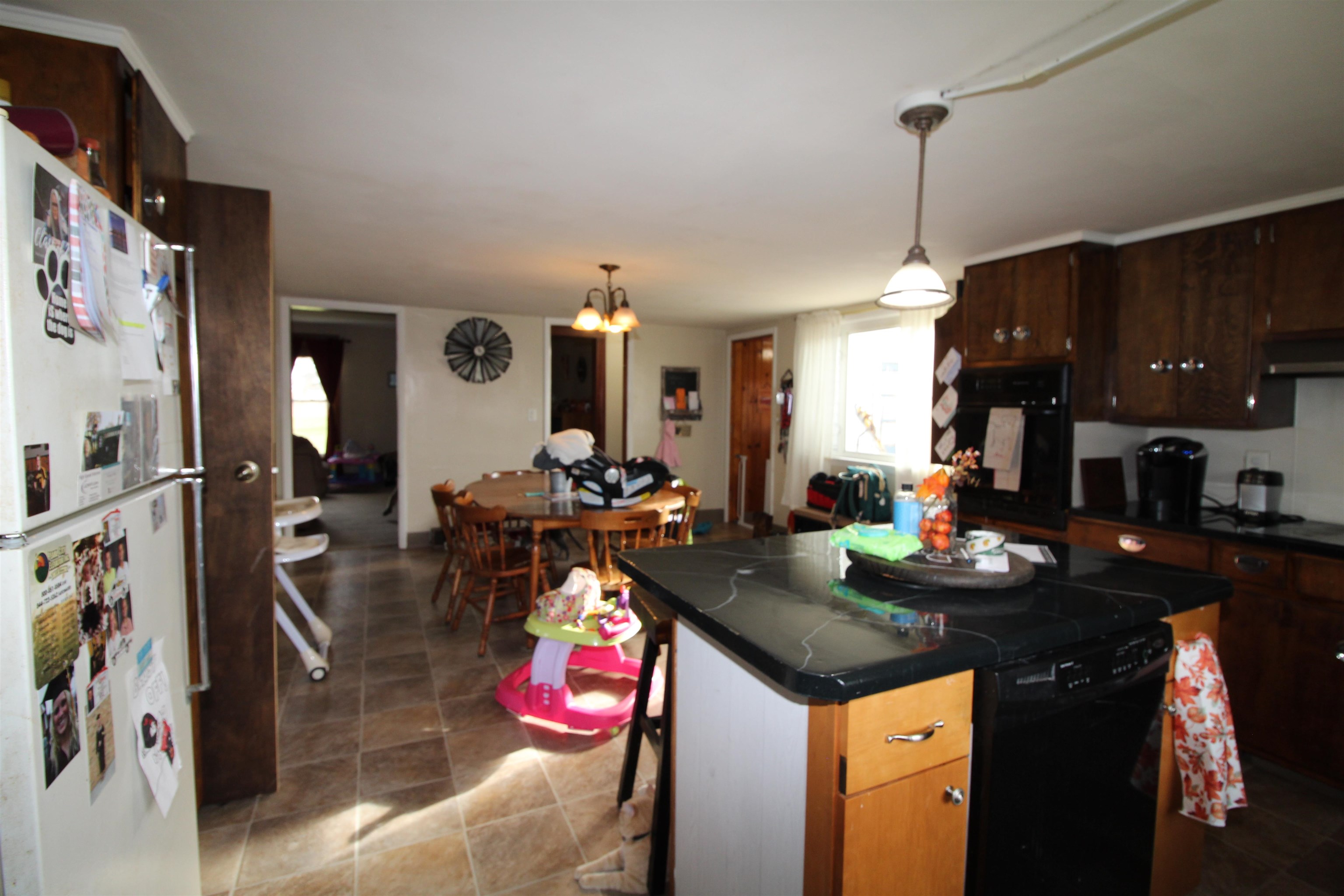 3543 West Prairie Road Freeport, IL 61032 - Photo 8 of 28 a kitchen with granite countertop a sink stove and cabinets