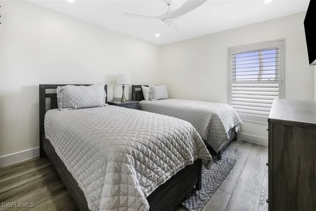 a bed room with a bed and a window