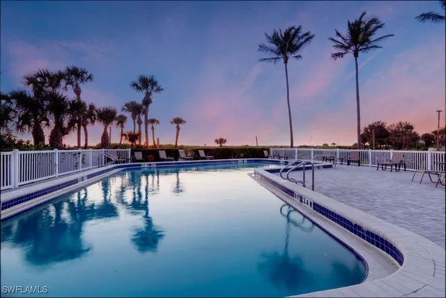 a view of a swimming pool and a chair