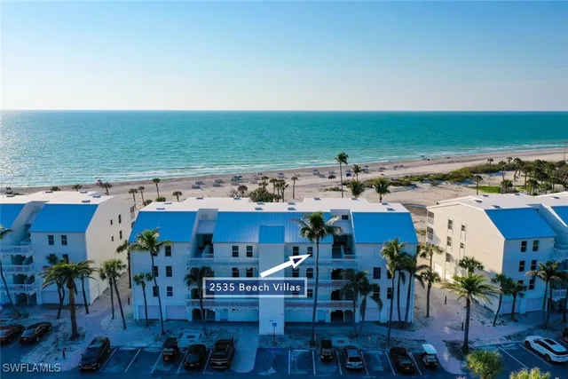an aerial view of a building with outdoor area