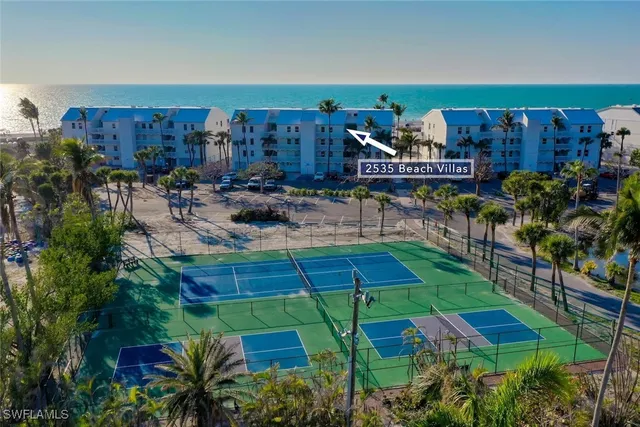 a view of a backyard with plants and a patio