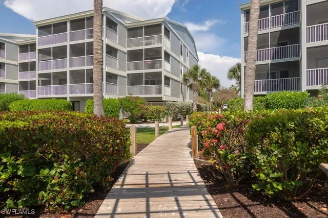 a view of a building with potted plants