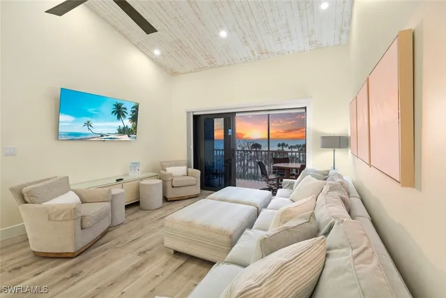 a living room with furniture large window and couch