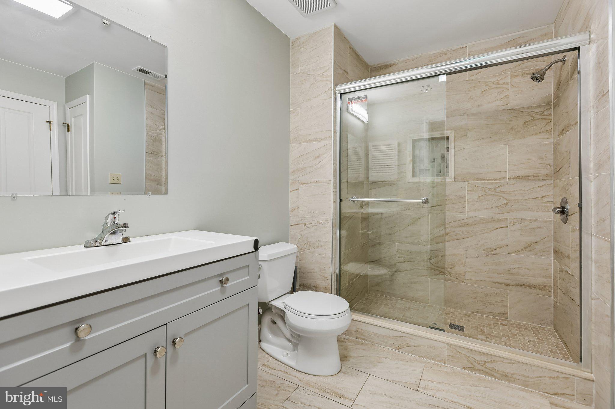 624 Brickhouse Road Princeton, NJ 08540 - Photo 31 of 43 a bathroom with a sink toilet a mirror and shower