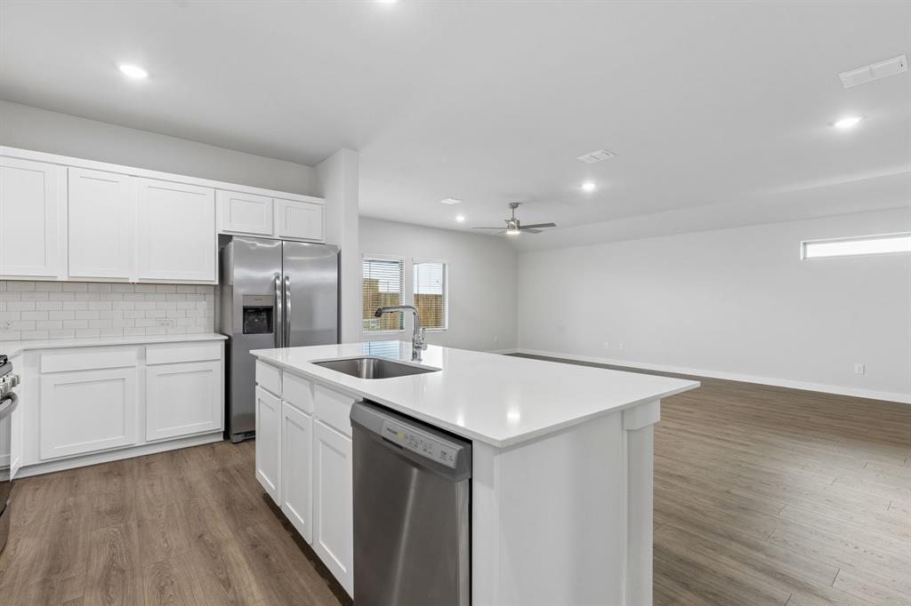 1428 Companero Street Haslet, TX 76052 - Photo 8 of 33 Kitchen in the Oscar home plan by Trophy Signature Homes – REPRESENTATIVE PHOTO