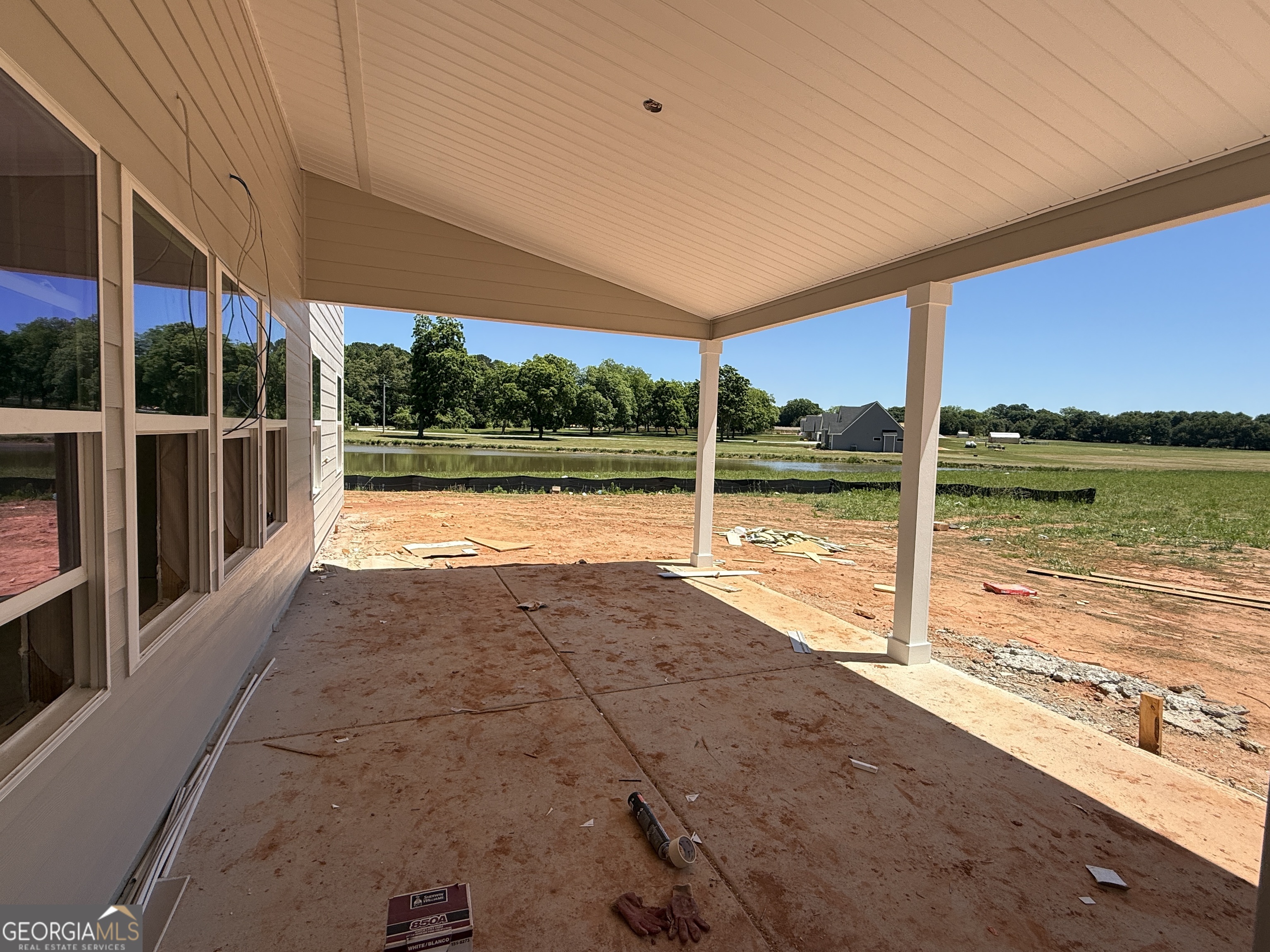 10 Rex Road Williamson, GA 30292 - Photo 5 of 63 a view of a patio with a table and chairs under an umbrella