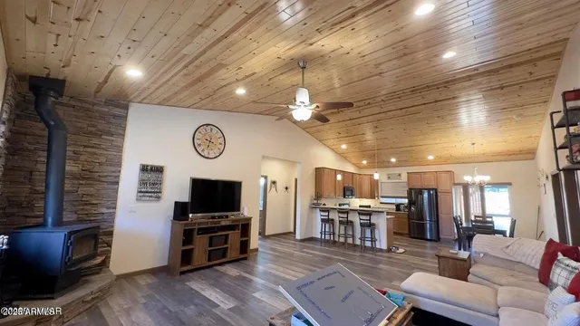 a view of a livingroom with furniture and a flat screen tv